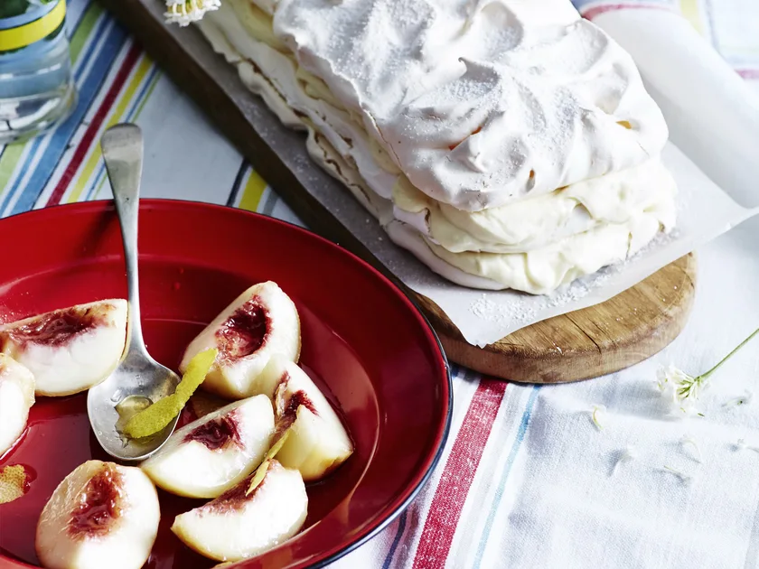 White chocolate meringue torte with liqueur peaches