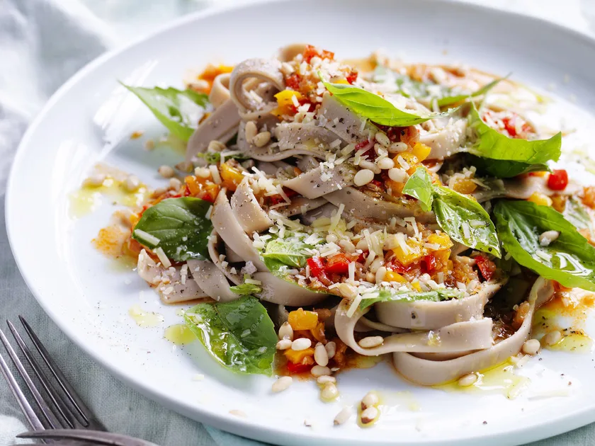 Spelt pasta with braised capsicum, nuts & chilli