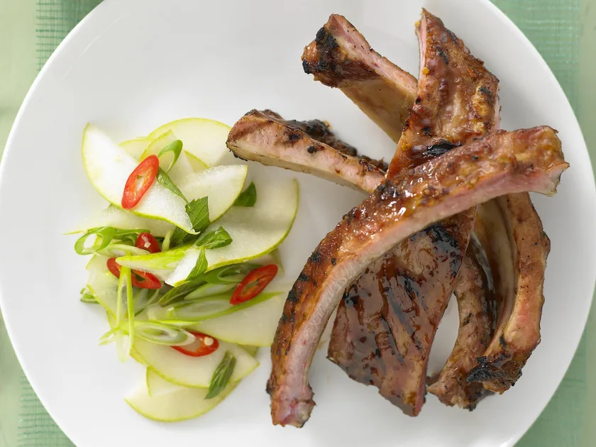 Plum and star anise pork spareribs with pear, ginger and chilli salad