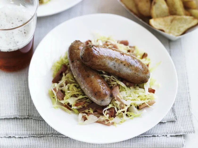 Pork sausages with crispy potatoes and cabbage