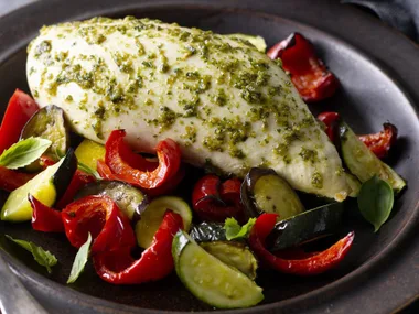 pesto-marinated chicken breasts on mediterranean vegetables