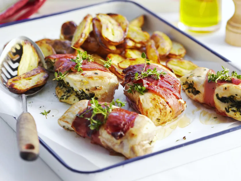Herb-stuffed chicken with tomato salad