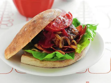 beef burger with roast tomato and caramelised onions