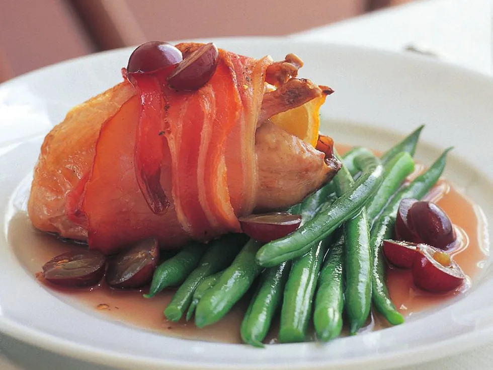 Bacon-wrapped quail with grape sauce