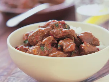 chilli marinated beef in spicy coconut sauce