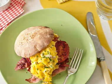 Toasted baps with sizzled ham, parmesan scrambled eggs, fried tomatoes & chives