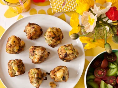 Smoked fish hash cakes with spring onions, dill, capers and aioli, with heirloom tomato salad