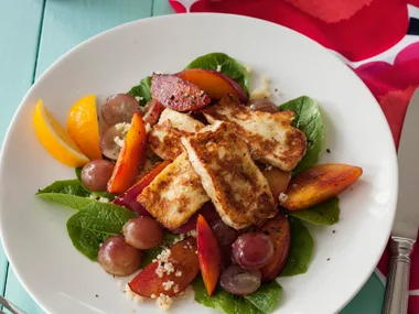 Fried haloumi with red grapes and grilled nectarines on couscous