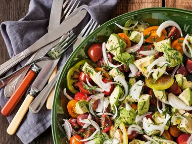 Heirloom tomato salad with avocado, lemon, onion and mint