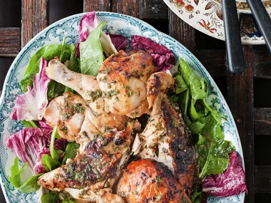 Roast chicken with lemon, herbs and winter salad