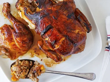Roast chicken with sausage and apricot stuffing