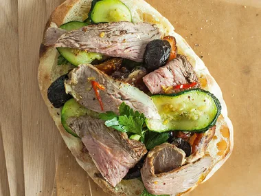 Lamb with dates, zucchini, lemon and chilli on Turkish flatbread