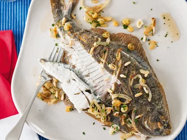 Barbecued flounder with pine nut, garlic and golden sultana dressing