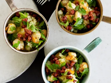 Scallops with chorizo on crushed potatoes