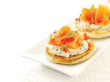 Mini herb pancakes with cream cheese and smoked salmon