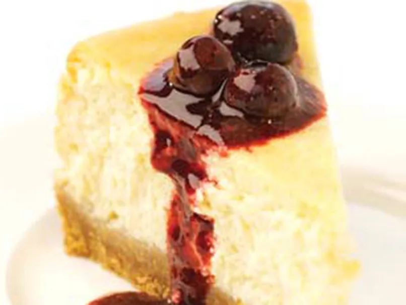 New York cheesecake with blueberry and blackberry drizzle