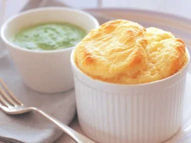 Goat cheese soufflé with creamed spinach sauce