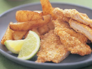 Oven-baked chicken schnitzel with spicy wedges