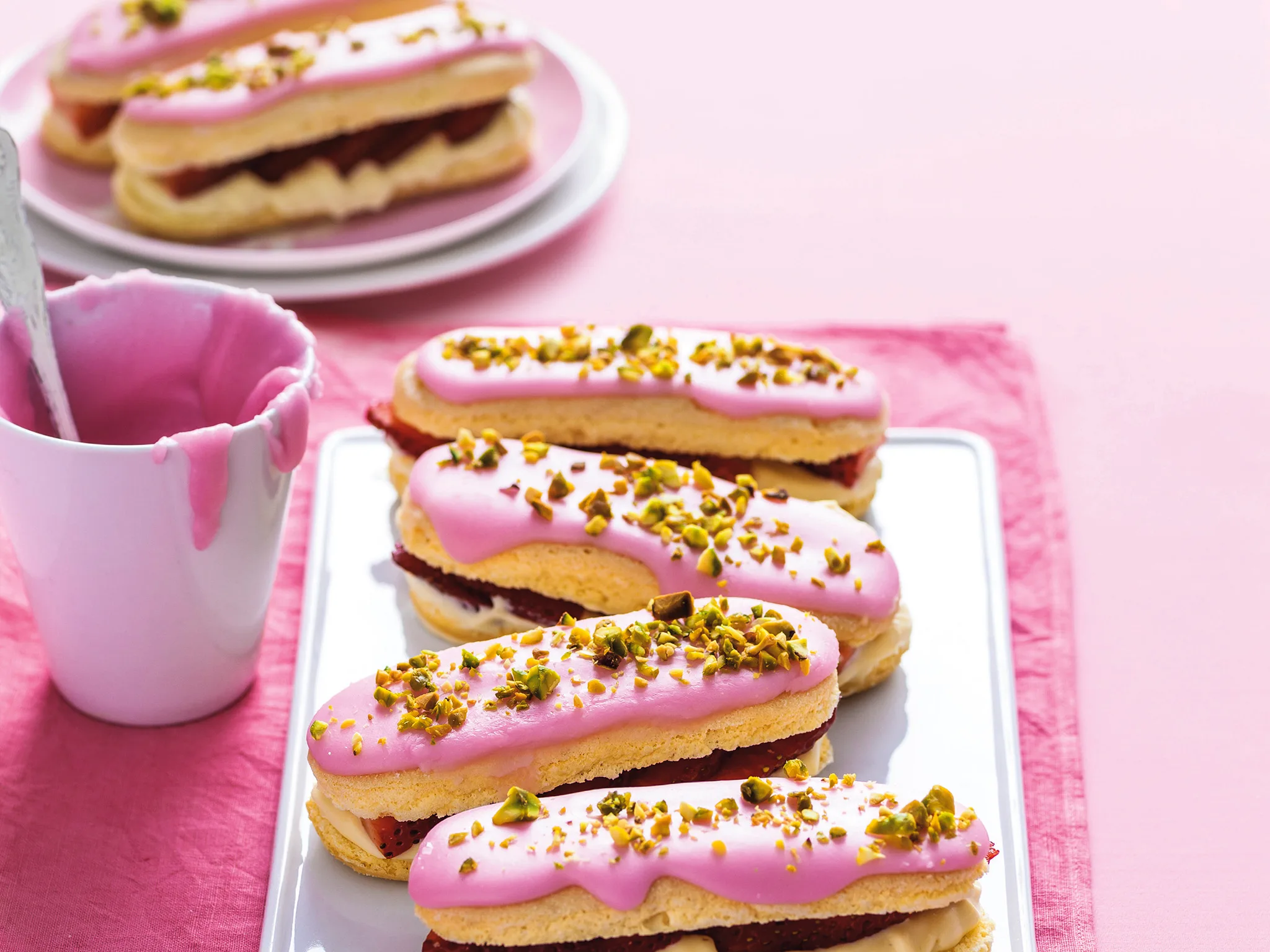 Strawberry and pistachio eclairs