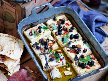 Baked feta with roasted garlic, chilli and olives
