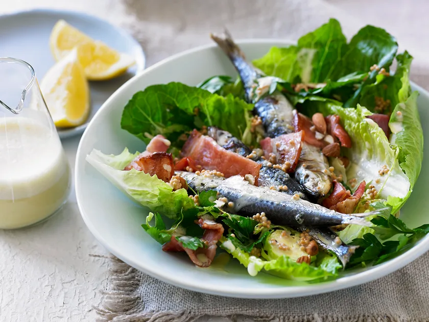 Caesar salad with grilled sardines