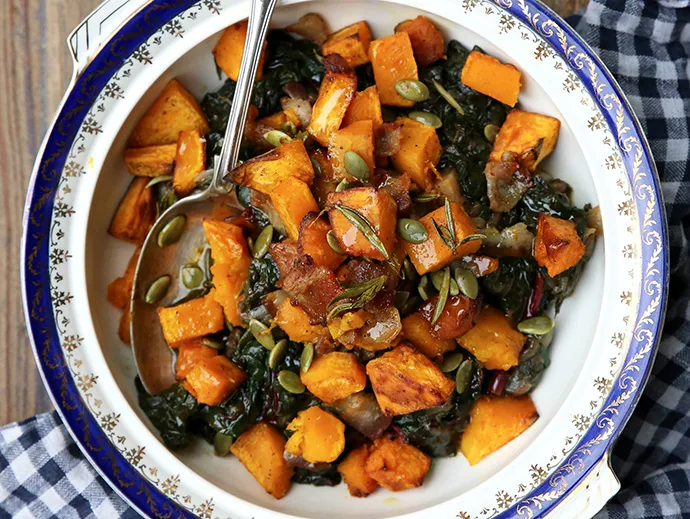 Braised silverbeet topped with bacon and rosemary roasted pumpkin