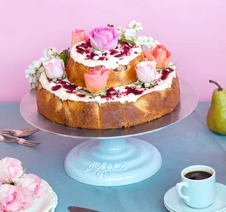 Orange, raspberry and white chocolate cake with honey cream cheese icing