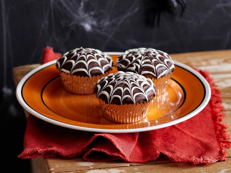 Choc cobweb cupcakes