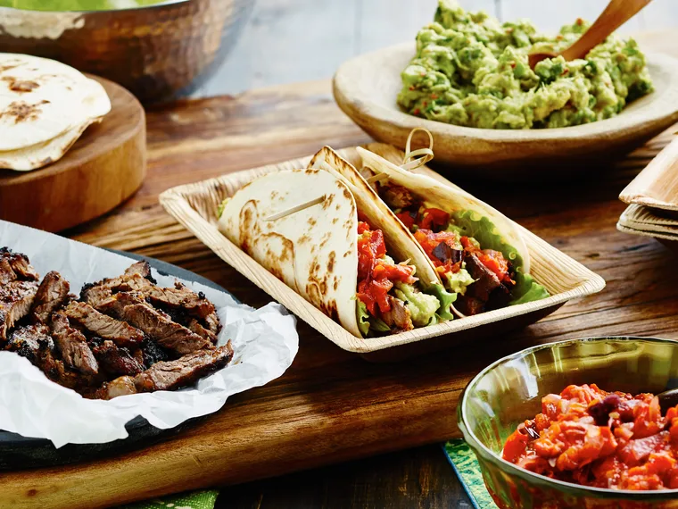 Steak carne asada soft tacos with guacamole & salsa roja