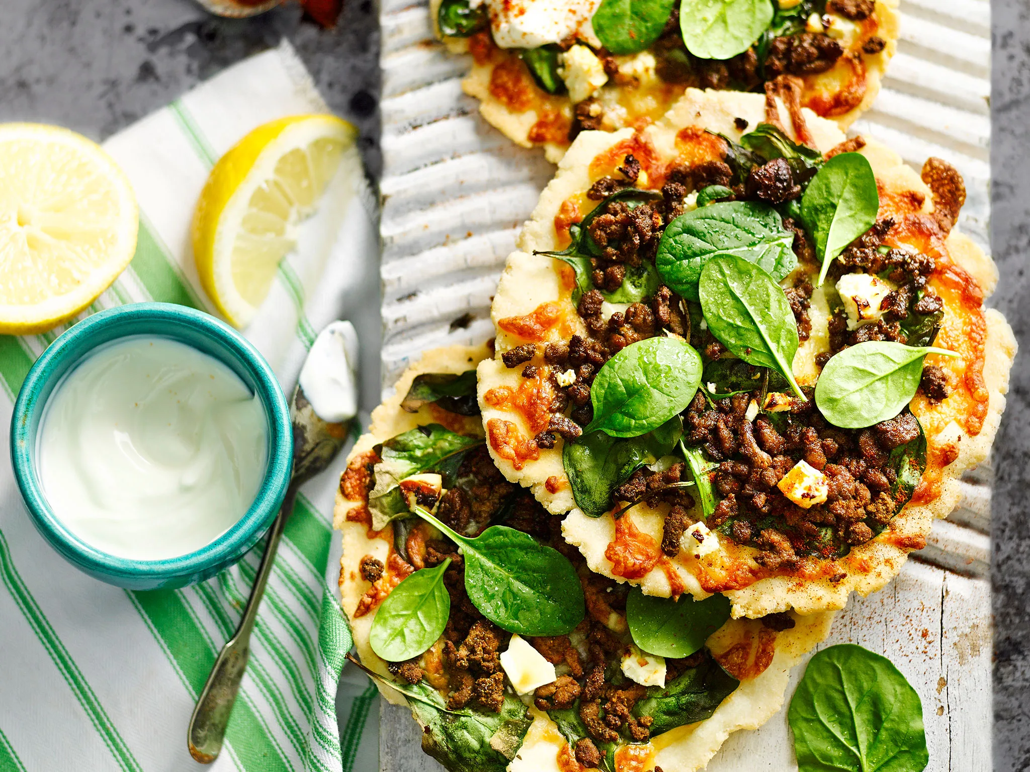 Spicy lamb, spinach and feta pizzas