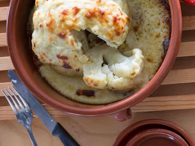 Whole baked cauliflower cheese
