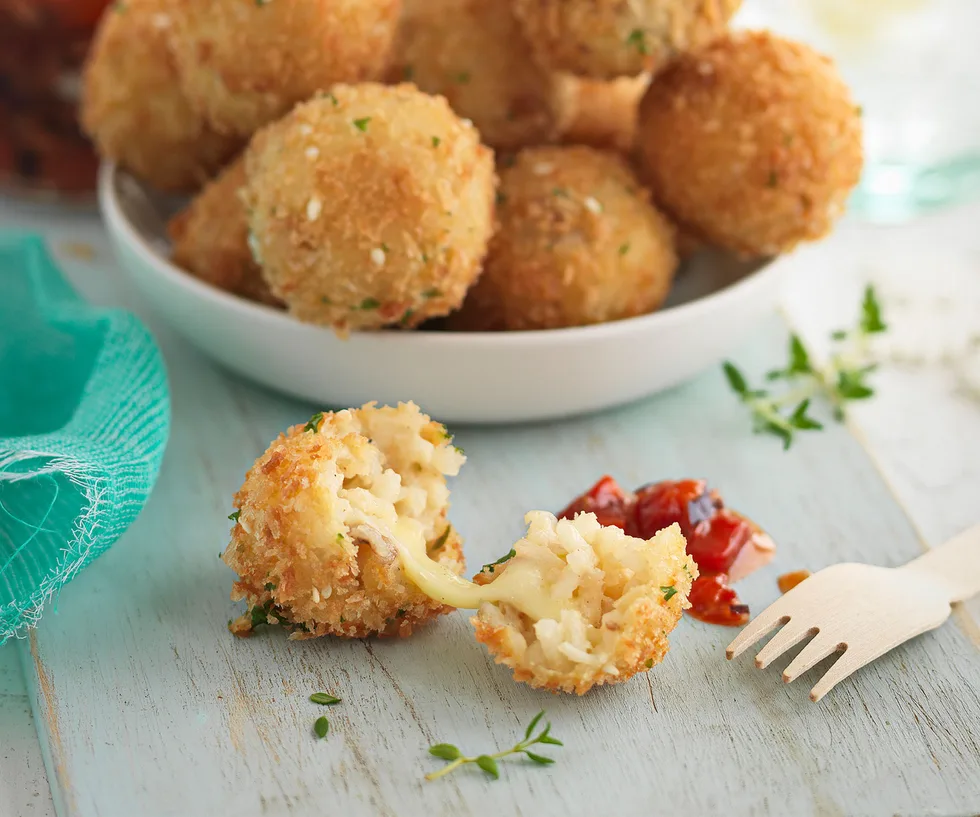 Melting mozzarella risotto balls with sweet salsa