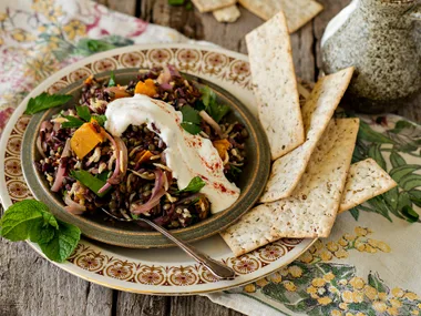 Lentil and rice salad with fried onions and yoghurt dressing