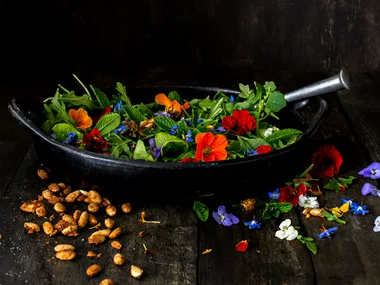 Leafy salad with spiced almonds & frida flowers