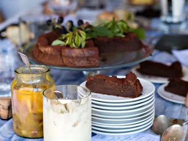 Flourless chocolate cake with greengage compote and marscapone