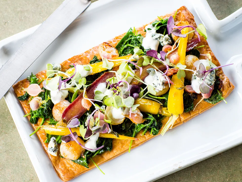 Glazed baby vegetable tart with creamy blue-cheese topping