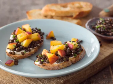 Pickled peach and black beluga lentil toasts