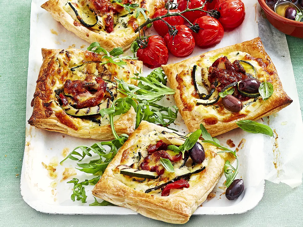 Zucchini and ricotta open pies with olive salsa