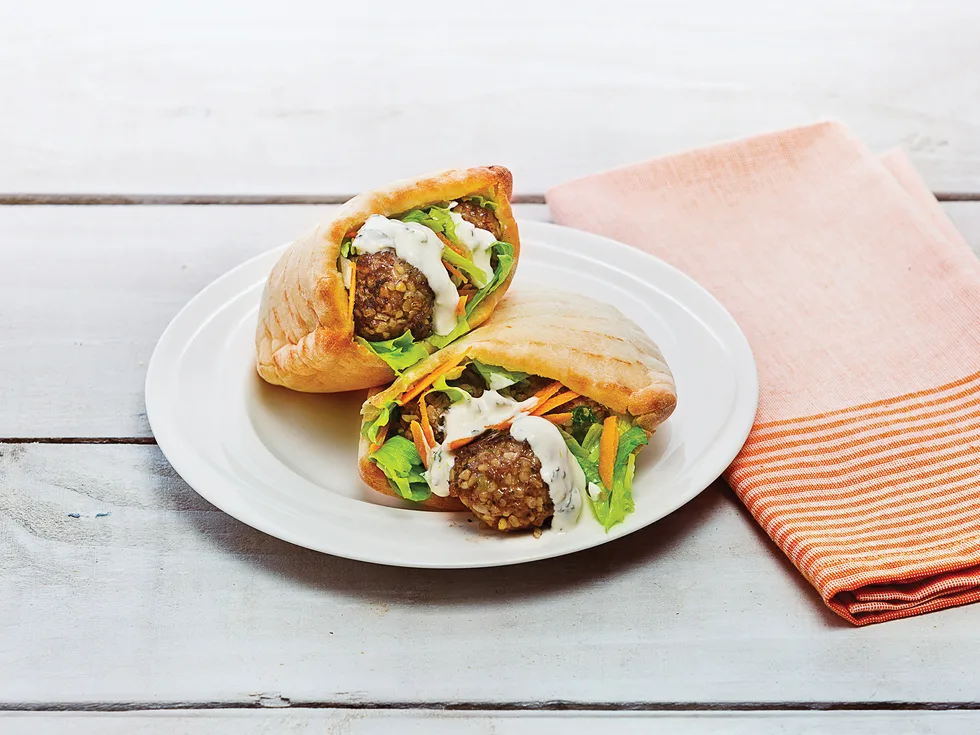 Cracked wheat and beef meatballs with pita bread and yoghurt sauce