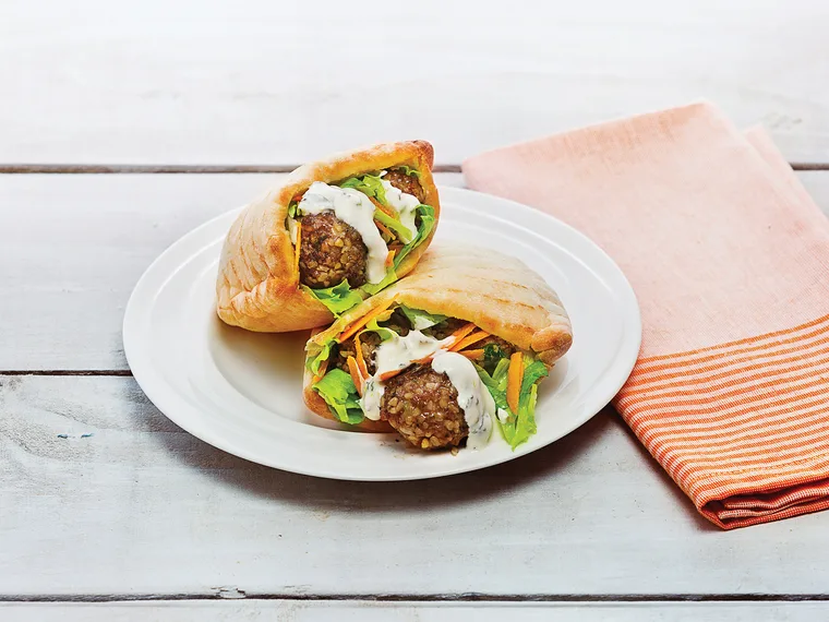 Cracked wheat and beef meatballs with pita bread and yoghurt sauce