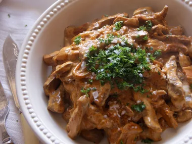 Venison stroganoff with saffron cap mushrooms and oven-baked chips