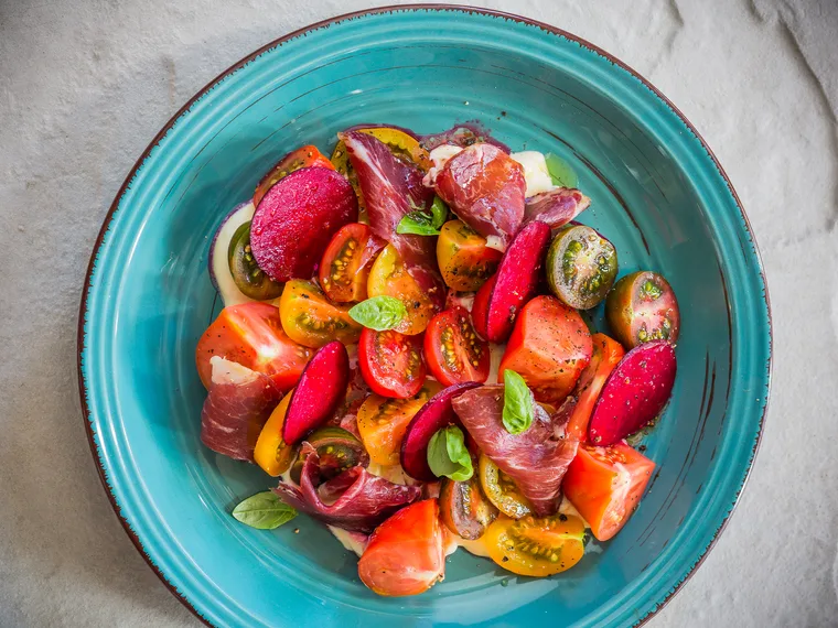 Tomato salad with shaved beets, truffled mascarpone and bresaola