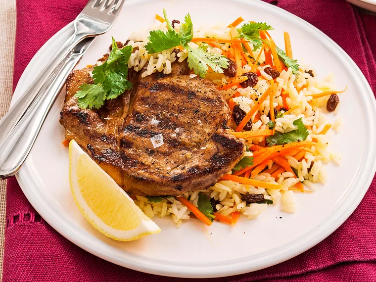 Cumin pork chops with rice and carrot salad
