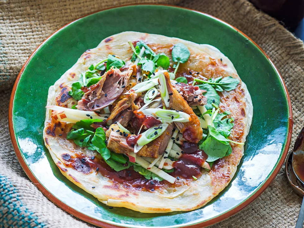 Spiced duck, apple and watercress roti rolls