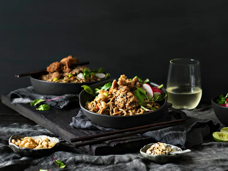 Warm soba noodle salad with crispy sesame chicken