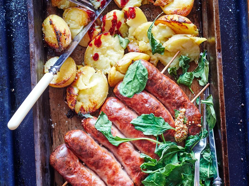 Sausages with crushed crispy potatoes