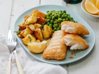 Fish with crushed peas and herby potatoes