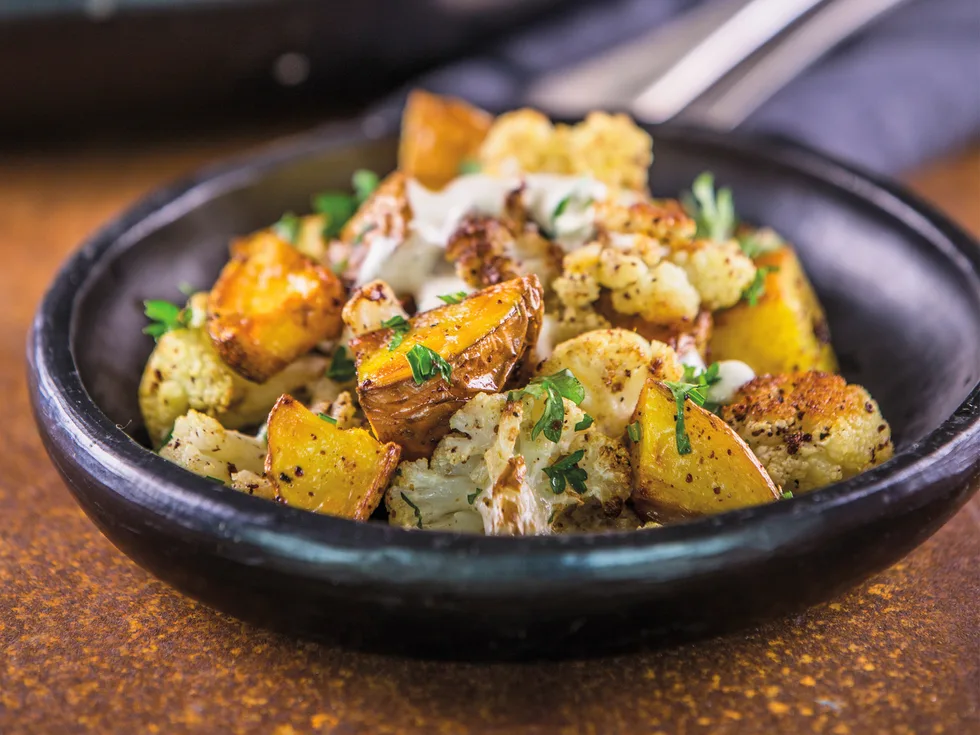 Roasted potatoes and cauliflower with tahini dressing
