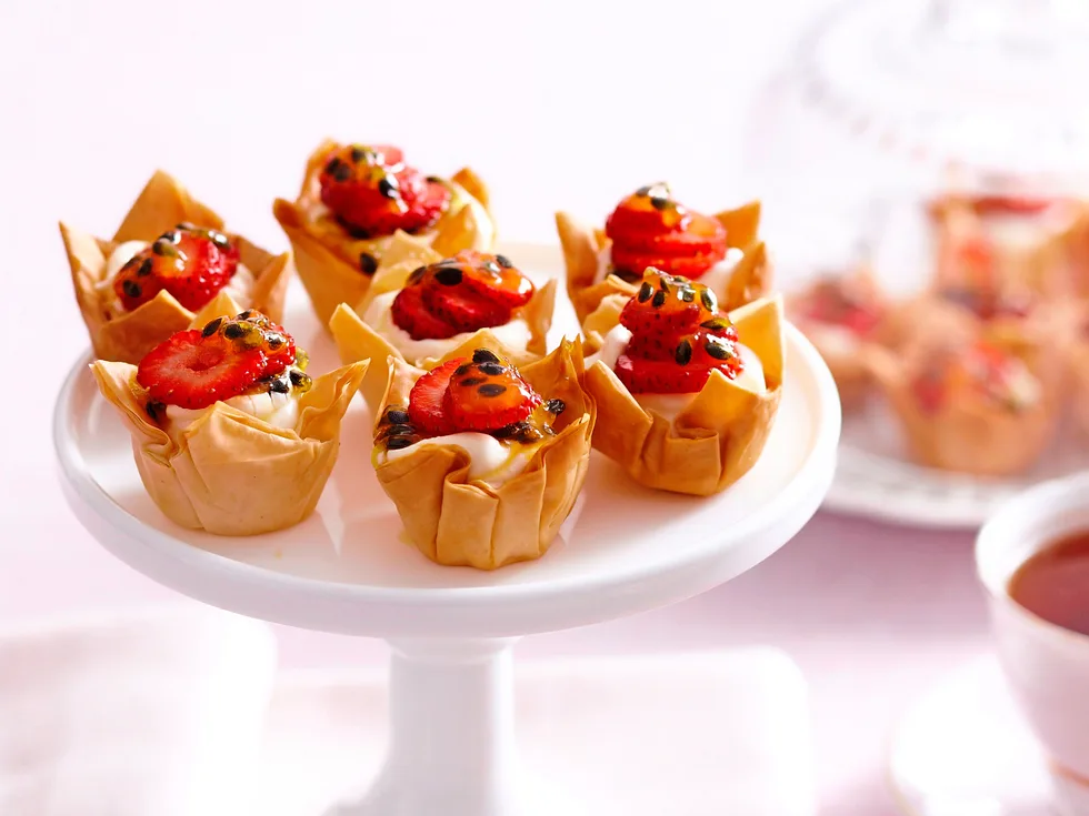 Mini cheesecakes with strawberries and passionfruit