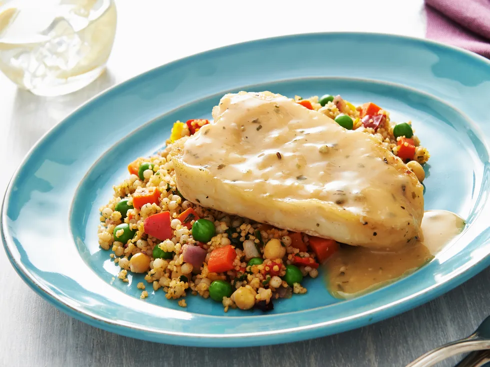 Steamed lemon fish with pearl couscous and chickpeas
